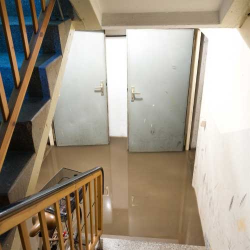A flooded basement due to improper sump pump installation or maintenance